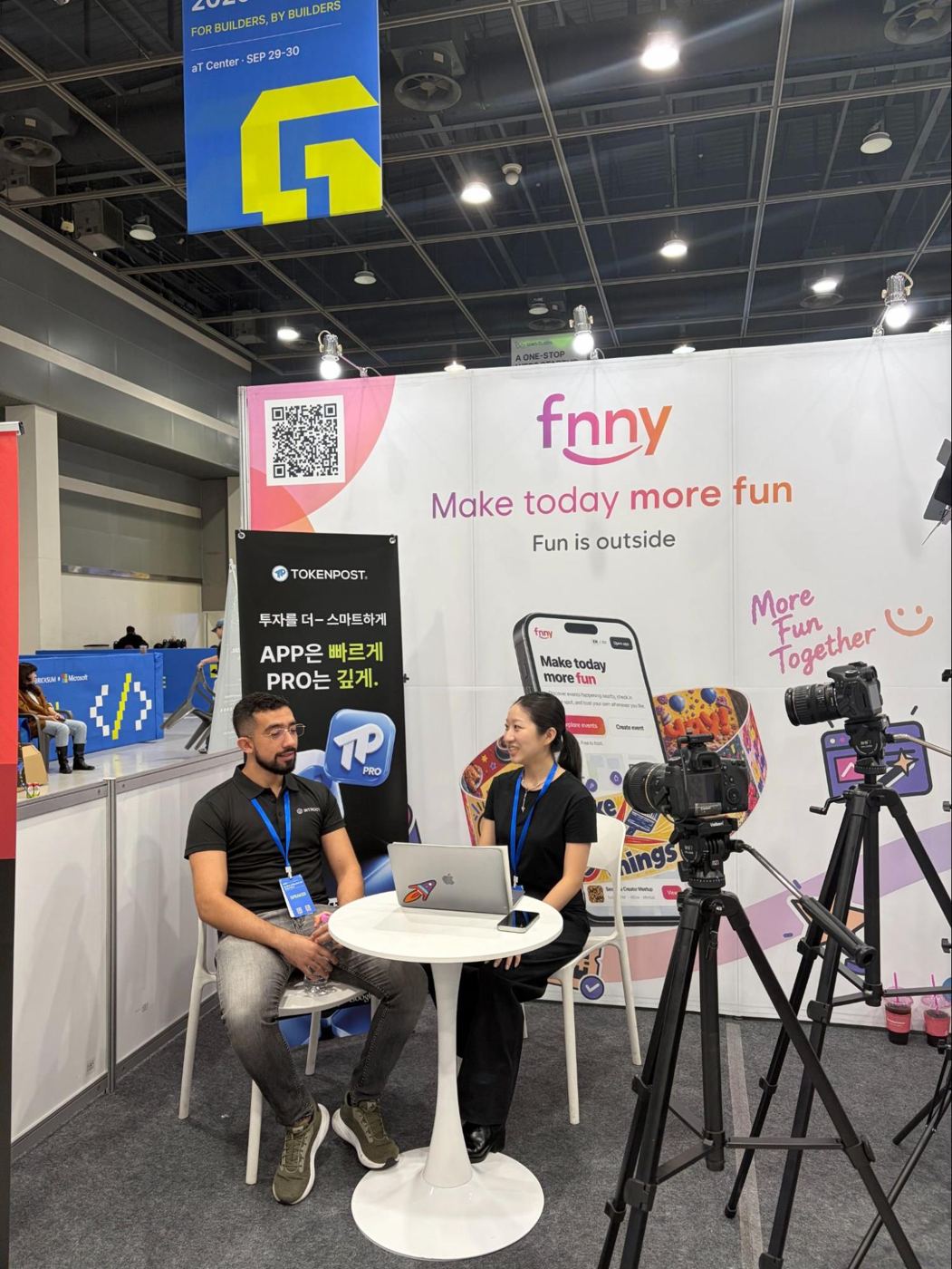The Bitroot team being interviewed in the exhibition area
